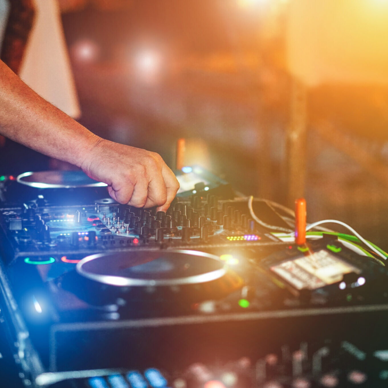 Dj mixing outdoor while streaming a online party festival during Coronavirus time - Alternative fest on isolation quarantine - Soft focus on hand - Fun, tech and entertainment concept