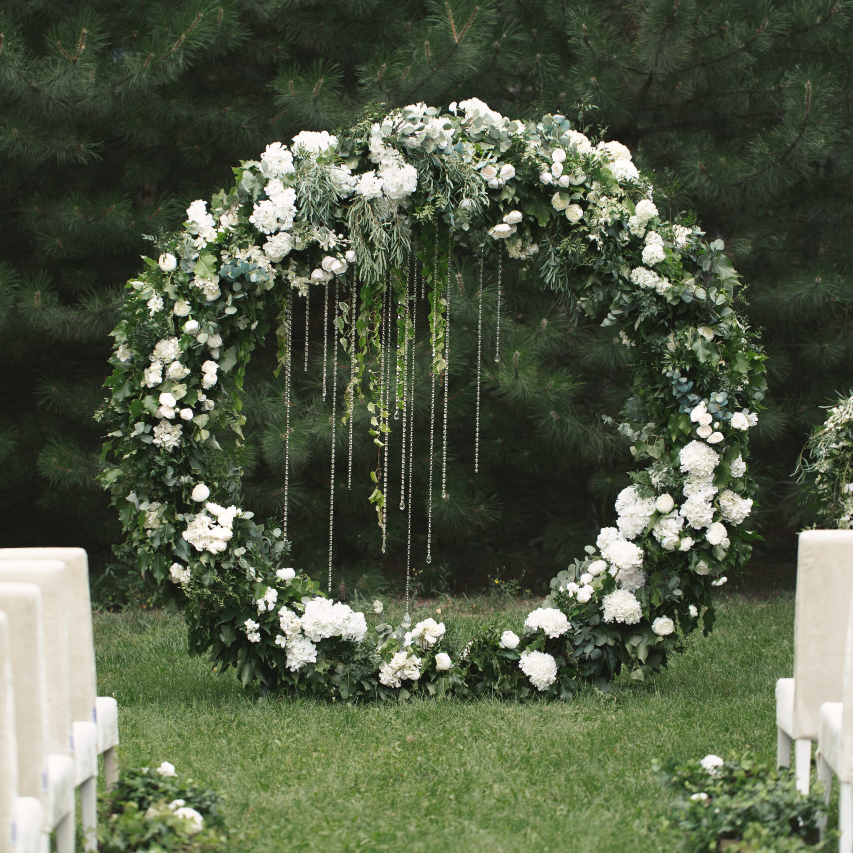 circle wedding arch with flower petals and candles